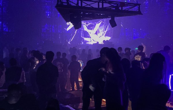 This photo taken on September 26 shows party-goers in a club in Wuhan, China, the birthplace of COVID-19. [Hector RETAMAL / AFP]