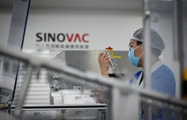 China attempts to repair reputation in last-ditch push for COVID-19 vaccine