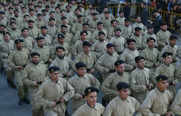 Members of the Resistance Brigades, a paramilitary group aligned with Hizbullah, march in a military parade in southern Beirut in this undated photo. [Al-Mashareq] 
