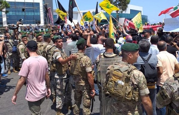 Hizbullah supporters wave flags at Beirut airport in an undated photo. [Photo via social media]