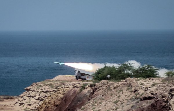 Members of Iran's Islamic Revolutionary Guard Corps (IRGC) fire missiles into the Arabian Gulf as part of recent war simulations that envision the targeting of US naval forces and commercial tankers. [IRGC]