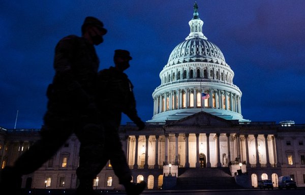 Members of the US National Guard patrol the US Capitol in Washington on January 17. [Andrew Caballero-Reynolds/AFP]