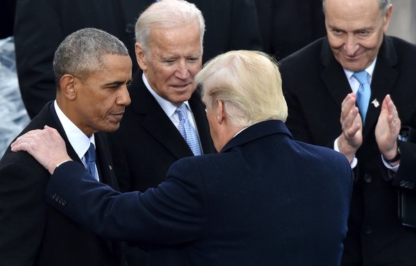 In this photo taken January 20, 2017, then-US President Donald Trump speaks with predecessor Barack Obama and Joe Biden, the outgoing vice president, as Senator Chuck Schumer looks on during inauguration ceremonies in Washington, DC. [Paul J. Richards/AFP]