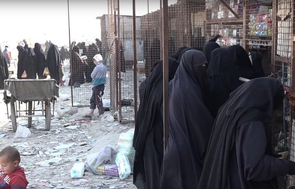 ISIS women shop at a store in al-Hol camp in Syria's al-Hasakeh province. [Video screenshot/Hawar News Agency]