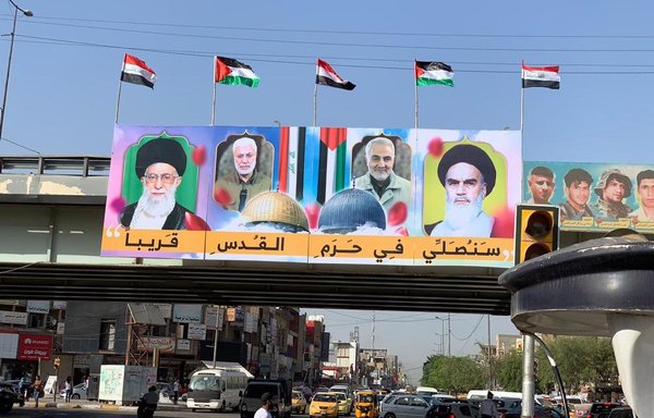 Posters of Iranian leaders hung by pro-Iran militias in Baghdad are seen here on May 18. [Afaq satellite channel website]