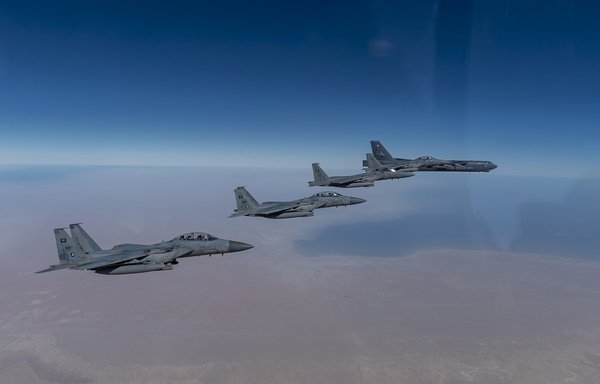 A US B-52 bomber flies with Saudi fighters over the Middle East on January 27. [CENTCOM]