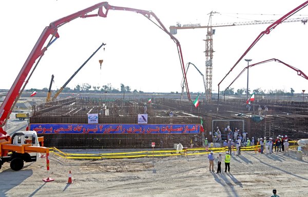 A picture taken November 10, 2019, shows workers on the construction site of a second reactor in Iran's Bushehr nuclear power plant, during an official ceremony to kick-start the work at the facility. [Atta Kenare/AFP]