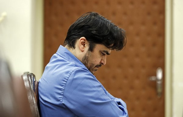In this file photo, taken June 2, Rouhollah Zam, a former opposition figure who had lived in exile in France, speaks during his trial at Iran's Revolutionary Court in Tehran. On December 12, Zam was hanged in Iran. [Ali Shirband/Mizan News/AFP]