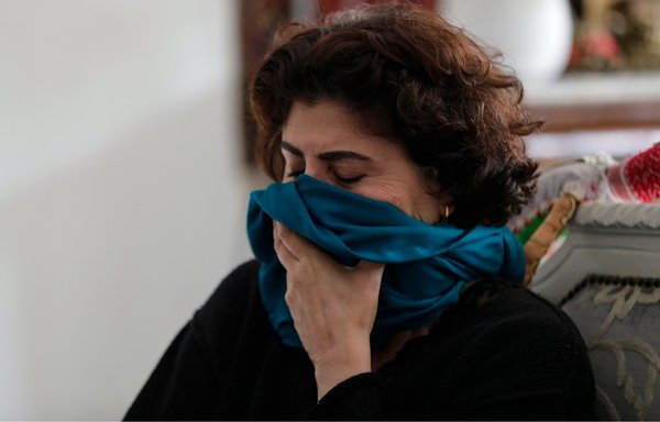 Rasha al-Ameer, the sister of slain Lebanese activist Lokman Slim, reacts to news of his death on February 4. [Anwar Amro/AFP]