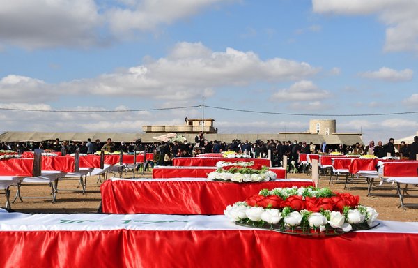 Under cloudy skies, residents of the northern Iraq district of Sinjar attend a February 6 mass funeral for 104 ISIS victims in the village of Kojo. [Yazda/Twitter]