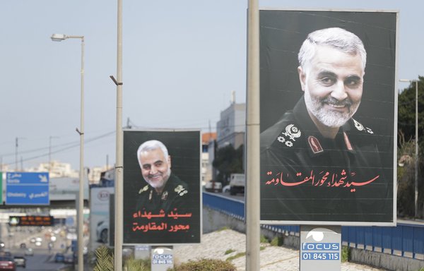 Portraits of slain Iranian military commander Qassem Soleimani are pictured on the main road leading to the Rafik Hariri airport in Beirut on January 11, 2020. Hizbullah continues to use the airport to receive flights from Iran carrying operatives and weapons. [Joseph Eid/AFP]