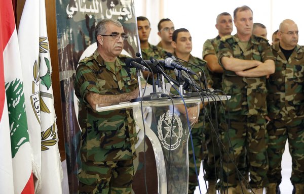 Lebanese army spokesman Ali Kanso (L) speaks during a news conference at the Ministry of Defence in Yarze east of Beirut on August 19, 2017, about the army's operation against ISIS in Arsal. [Anwar Amro]