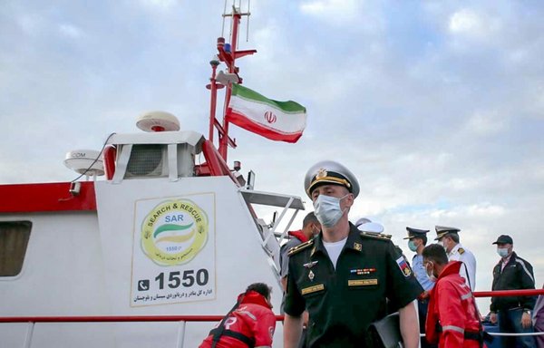 A Russian naval officer visits an Iranian ship at the start of the February Maritime Security Belt Exercise in the northern Indian Ocean. [Iranian Ministry of Defence]