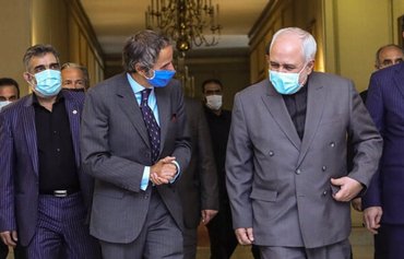 Iran warned against provocation as temporary deal hashed out with IAEA