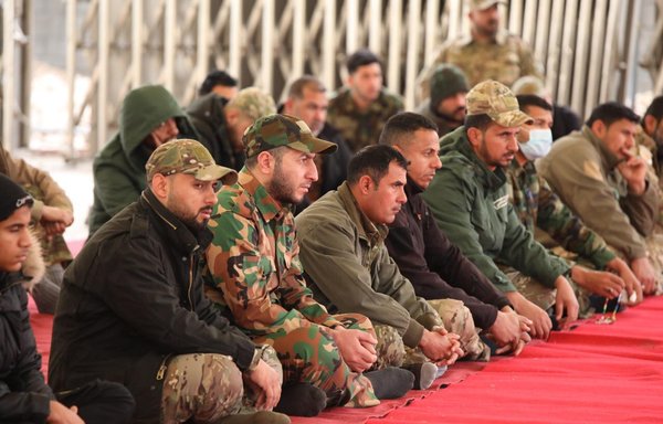 Al-Abbas Combat Division members, affiliated with Iraq's top Shia cleric Ali al-Sistani, take part in a religious ceremony on January 28. [Twitter]