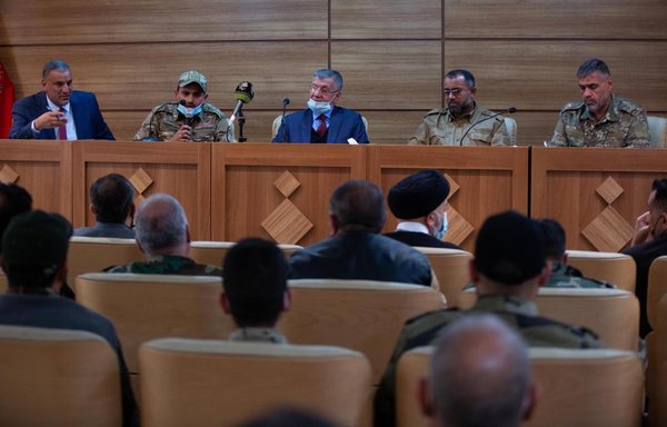 Al-Atabat al-Muqadasa members take part in a December 2 workshop, during a conference where they affirmed their compliance with 'the orders of the Iraqi government'. [Al-Kafeel Global Network]