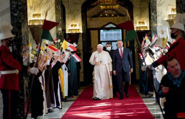 Pope Francis upon his arrival at Baghdad Airport on March 5, where he was greeted by Iraqi Prime Minister Mustafa Kadhemi. [Iraqi Prime Minister's Media Office]