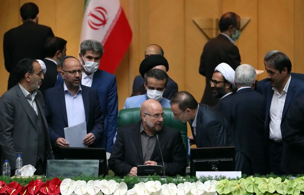 Mohammad-Bagher Ghalibaf (centre), former IRGC commander and previous mayor of Tehran, sits among members of Iran's parliament (Majles) after being elected as speaker on May 28. [AFP]