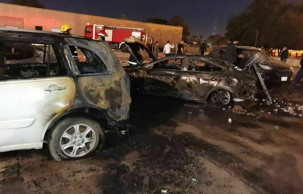 Charred cars are seen after a rocket strike on the Green Zone in central Baghdad on February 22 in this photo, which was circulated online.