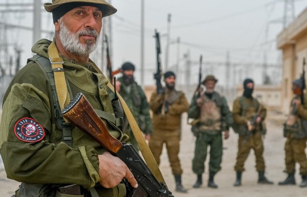Armed members of ISIS Hunters, a Russian private security company that operates in Syria, are seen at an oil well in rural Deir Ezzor. [ISIS Hunters/Twitter]