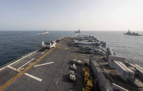US Navy Ticonderoga-class cruiser USS Port Royal (left), French Navy aircraft carrier Charles de Gaulle (centre), Japanese Maritime Self-Defence Force destroyer JS Ariake (right) and the amphibious assault ship USS Makin Island transit the Arabian Sea in support of Gulf Arabian Sea Warfare Exercise (GASWEX) 21 on March 19. [CENTCOM]