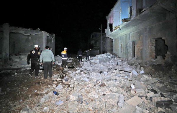 Members of the White Helmets search for survivors and victims following a reported Russian air strike in al-Fua, Idlib province, Syria, March 2, 2020. [Omar Haj Kadour/AFP]