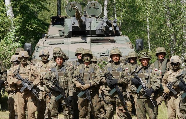 Polish and US troops take part in the DEFENDER-Europe 20 joint military exercise at Drawsko Pomorskie training grounds in Poland on June 17. Some 6,000 US and Polish soldiers participated. [Janek Skarzynski/AFP]