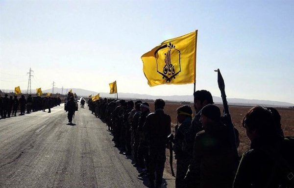 Fatemiyoun Division militiamen are seen here in an undated photo taken in the Syrian region of Palmyra. The militia is funded directly by Iran's IRGC and comprises mainly Afghan fighters. [Tasnim News Agency]