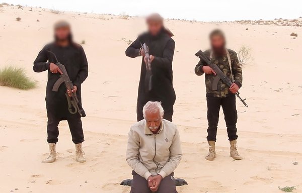 In a screenshot from a video posted April 17 on Telegram by ISIS's Sinai branch in Egypt, three ISIS militants are seen moments before executing 62-year-old Nabil al-Habashi Salama, a copt, in the town of Bir al-Abed.