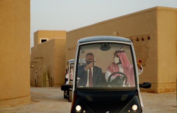 Saudi Crown Prince Mohammed bin Salman accompanies his guest, Iraqi Prime Minister Mustafa Kadhemi, on a tour of the historic al-Turaif district in al-Diriyah in Saudi Arabia on March 31. [Media office of the Iraqi prime minister]