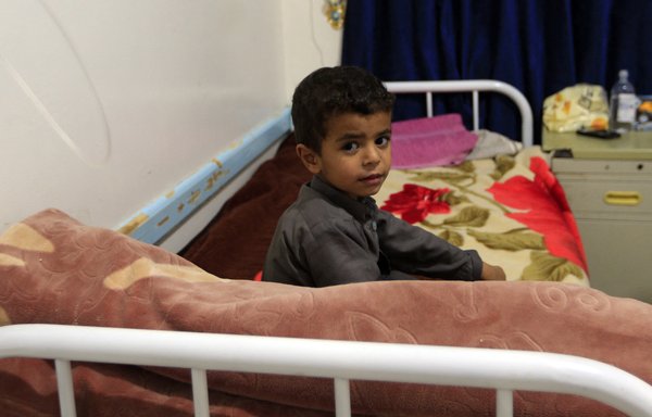 A Yemeni child receives treatment for measles on March 21 at al-Sabeen Maternity and Child Hospital in Sanaa. The Houthis abducted a number of medical workers from the hospital in mid April, local media reported. [Mohammed Huwais/AFP]