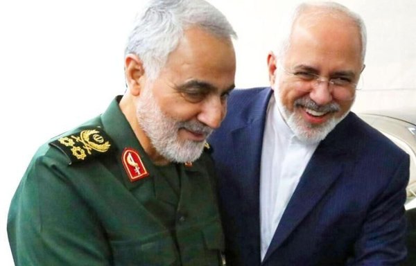 IRGC Quds Force commander Qassem Soleimani is seen here in an undated photo with Iranian foreign minister Javad Zarif. In a leaked audio file on April 25, Zarif criticizes Soleimani and government spending on the IRGC. [IRNA]