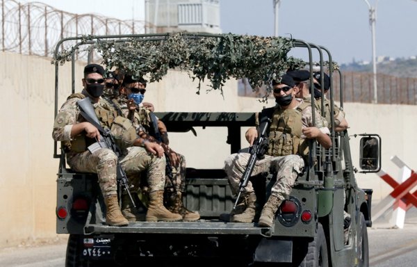 Lebanese troops patrol the area around the UNIFIL base in the border town of Naqoura, where Israeli and Lebanese delegations were having their first round of talks on the demarcation of the maritime frontier between the two countries, on October 14. [Mahmoud Zayyat/Al-Mashareq]
