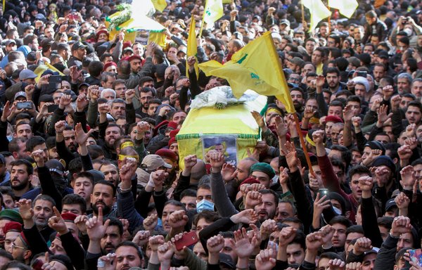 Supporters of IRGC-backed Lebanese Hizbullah carry coffins of group members killed in Syria during a funeral procession in a suburb of Beirut on March 1, 2020. [STR/AFP]