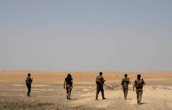 SDF fighters take part in a sweep operation in the desert area around Wadi al-Ajij, near Syria's border with Iraq. [SDF Co-ordination and Military Operations Centre]