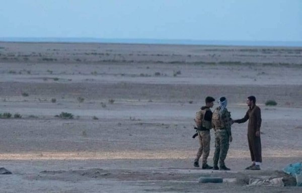 SDF members taking part in the ongoing anti-ISIS military operation in northern rural Deir Ezzor province check the ID of a local civilian. [SDF Military Media Command]