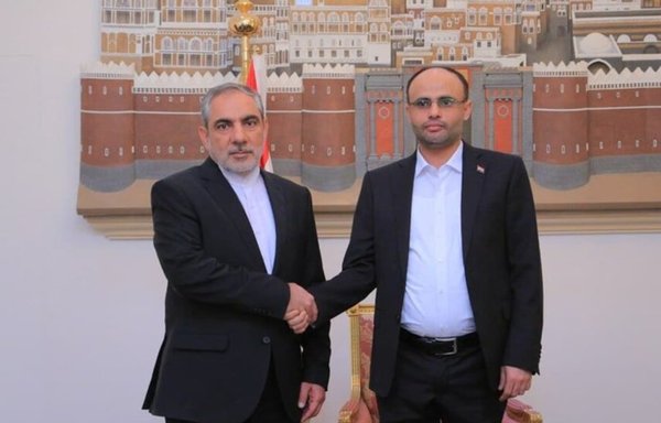 Iranian ambassador to Yemen Hassan Eyrlou (L) meets with the chairman of the Houthis' Supreme Political Council in November. [Mehr News]