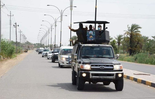 Iran-aligned Iraqi militiamen take part in a parade in Iraq's western province of Anbar on May 7. [Al-Fallujah 24]
