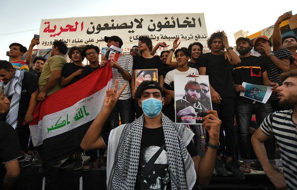 Iraqis demonstrate in Nasiriyah on May 25 to demand accountability for a recent wave of killings targeting activists. [Asaad Niazi/AFP]
