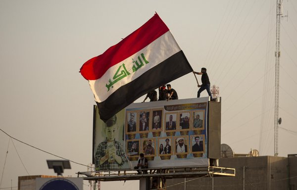 Iraqis demonstrate in the southern city of Basra on May 25 to demand accountability for a recent wave of killings targeting activists. [Hussein Faleh/AFP]
