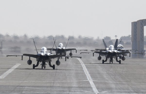 US Marine Corps F/A-18D Hornets taxi to their parking spots at Prince Sultan Air Base, Saudi Arabia, May 8. [US Air Force]
