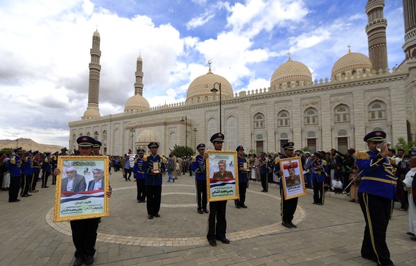 Houthi fighters take part in a funeral ceremony for Yahya al-Shami, assistant supreme commander of the Houthi forces, in Sanaa on April 27, a day after his death due to COVID-19. [Mohammed Huwais/AFP]