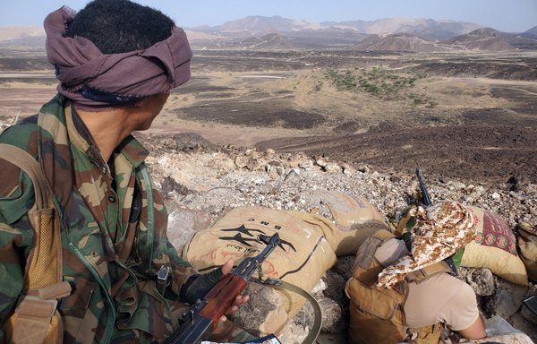 Fighters loyal to Yemen's government man a position near the frontline facing the Iran-backed Houthis in the country's northeastern province of Marib, on May 13. [STR/AFP]