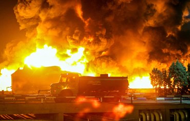 Navy ship, oil refinery fires singe Iranian regime's image