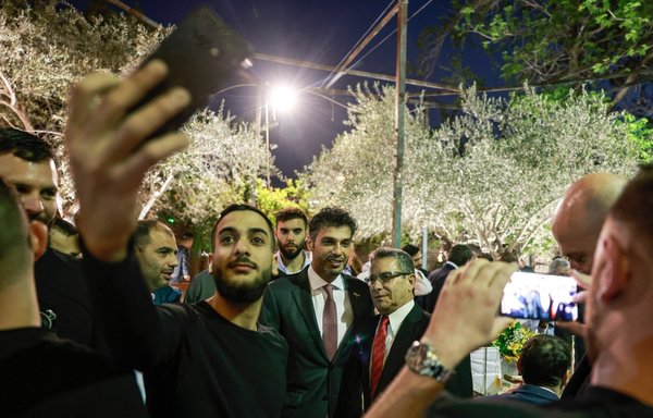 Arab-Israelis take "selfie" photo with the UAE ambassador to Israel Mohamed al-Khaja (C) during a Muslim fast-breaking "Iftar" meal in Abu Ghosh, near Jerusalem, on April 28. [Menahem Kahana/AFP]