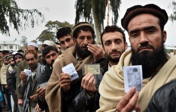 Afghan migrants receive residency cards in Iran in 2019. [Khabaronline.ir]