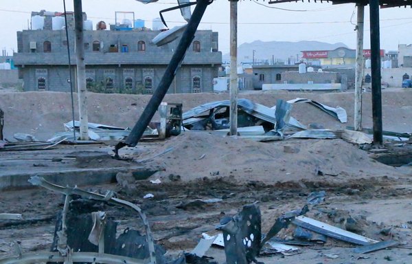 This picture taken June 5 shows a destroyed vehicle at the scene of a missile strike at a gas station in the northern Yemen city of Marib. Yemeni state media reported the strike killed at least 14 civilians, and blamed the attack on the Houthis. [AFP]