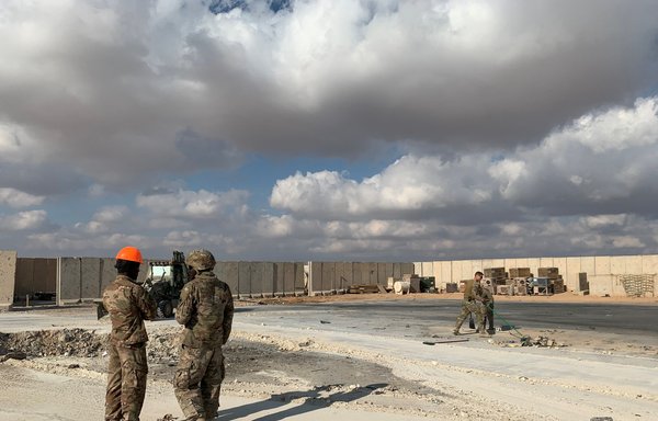 A picture taken January 13, 2020, shows US soldiers clearing rubble at Ain al-Asad military air base in the western Iraqi province of Anbar. [Ayman Henna/AFP]