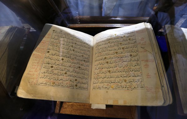 This picture taken on December 15 shows a view of a rare manuscript of the Holy Qur'an, Islam's holiest book, kept at the Grand Mosque in Sanaa. Yemeni and international officials are working to preserve Yemen's heritage even as the Iran-backed Houthi militia loots and smuggles artifacts out of the country. [Mohammed Huwais/AFP]