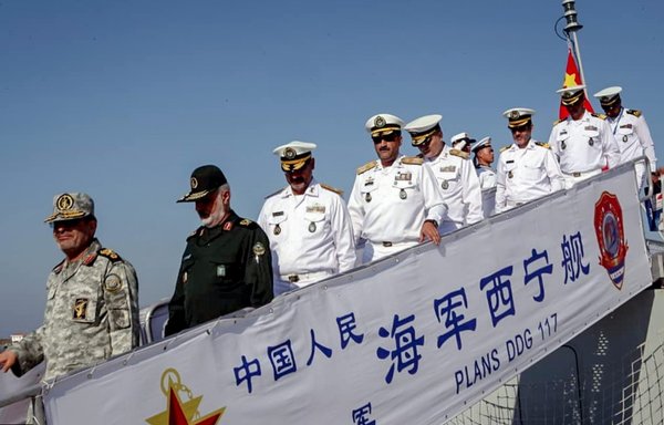 IRGC officers disembark from a Chinese warship in 2019. [Iranian Ministry of Defence]
